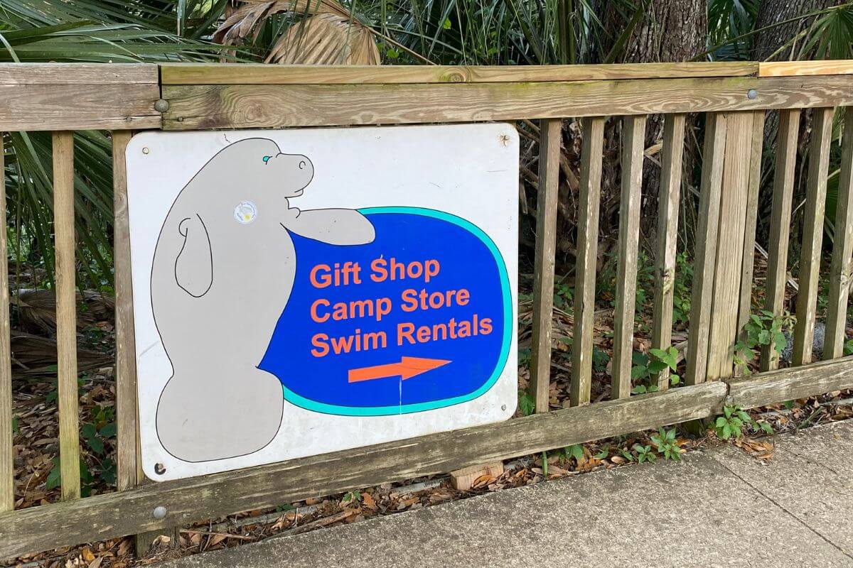 Sign that reads Gift Shop Camp Store Swim Rentals. 