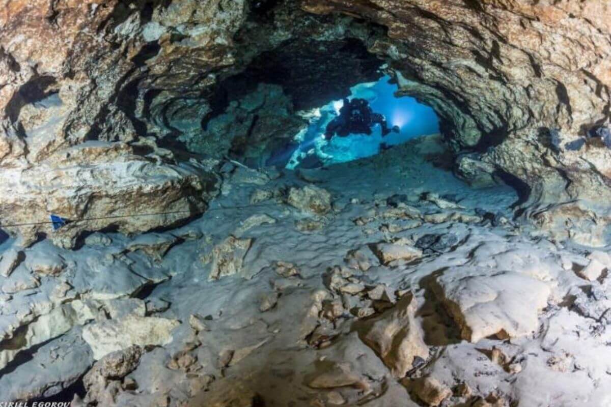 snorkeler in cave.