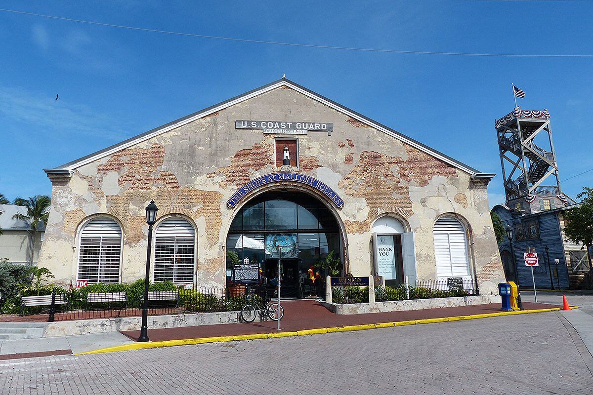 Exterior of building with words over the door that read The Shops at Mallory Square. 