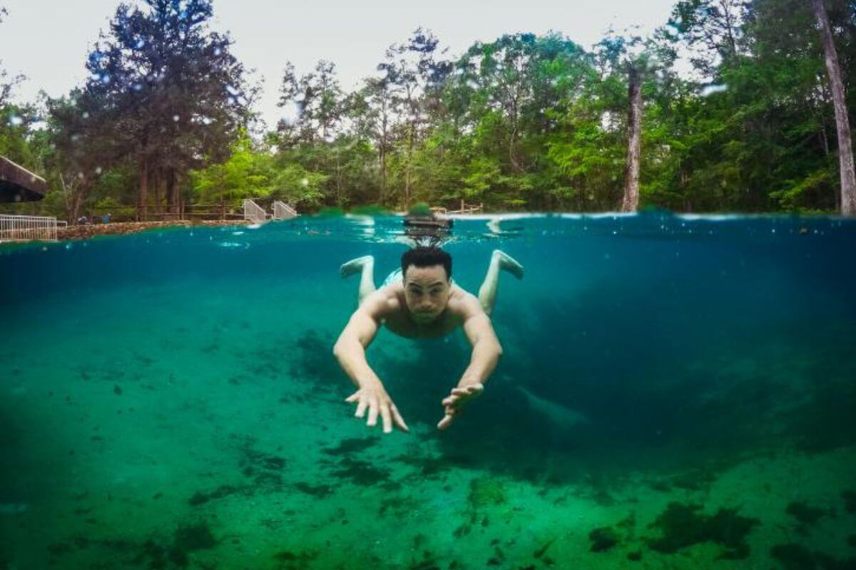 person swimming in spring.