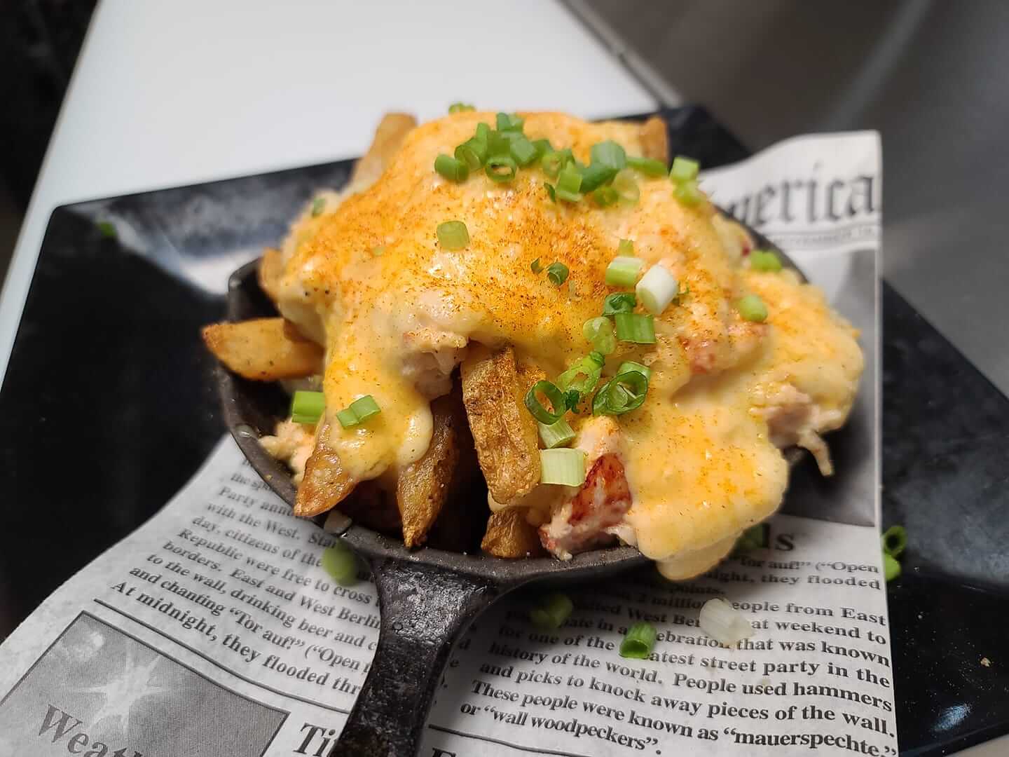 Fries topped with lobster and parmesan cheese served at a Florida Irish Pub 