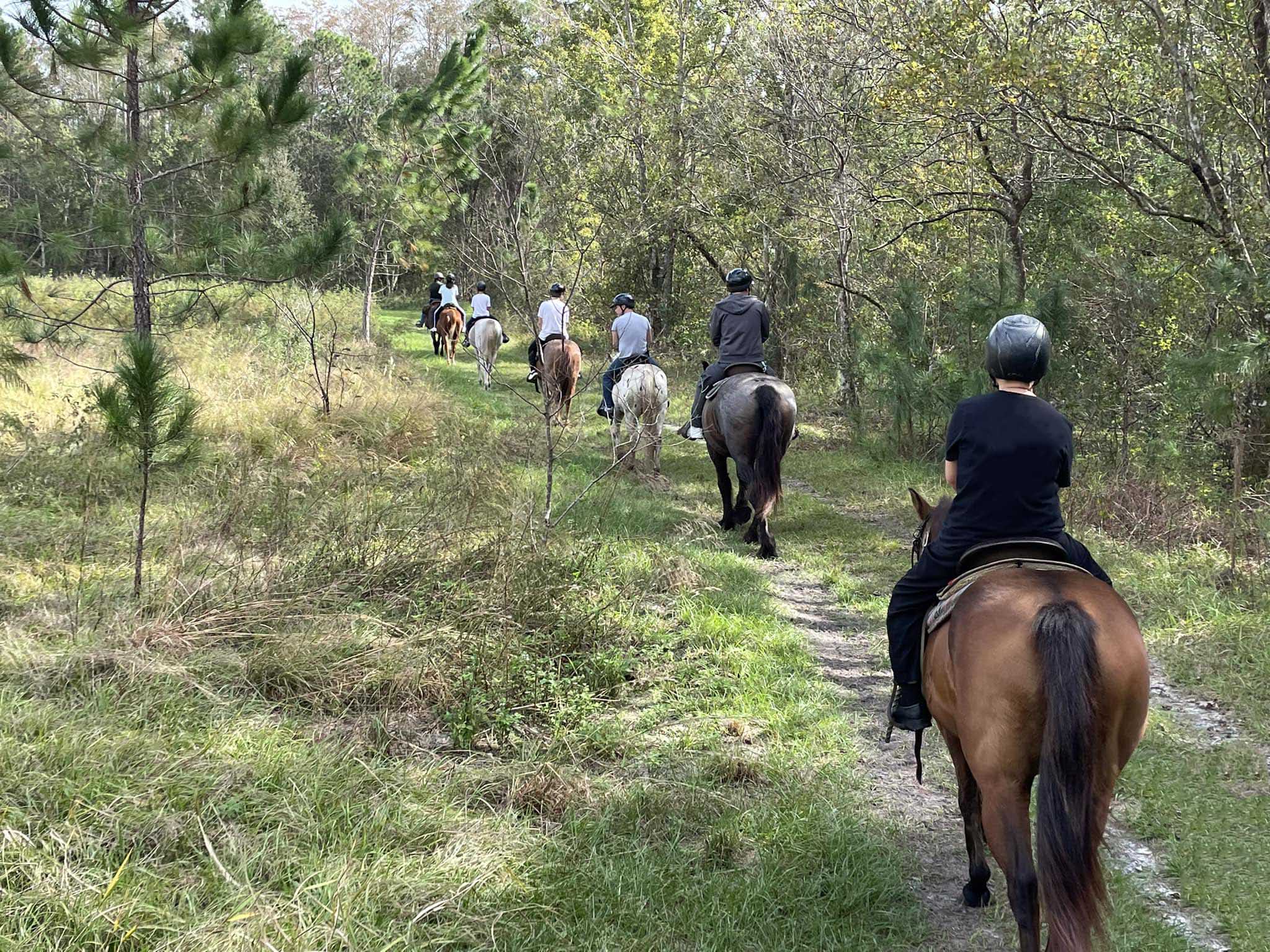 Group of people on a trail ride at Lake Louise Start Park