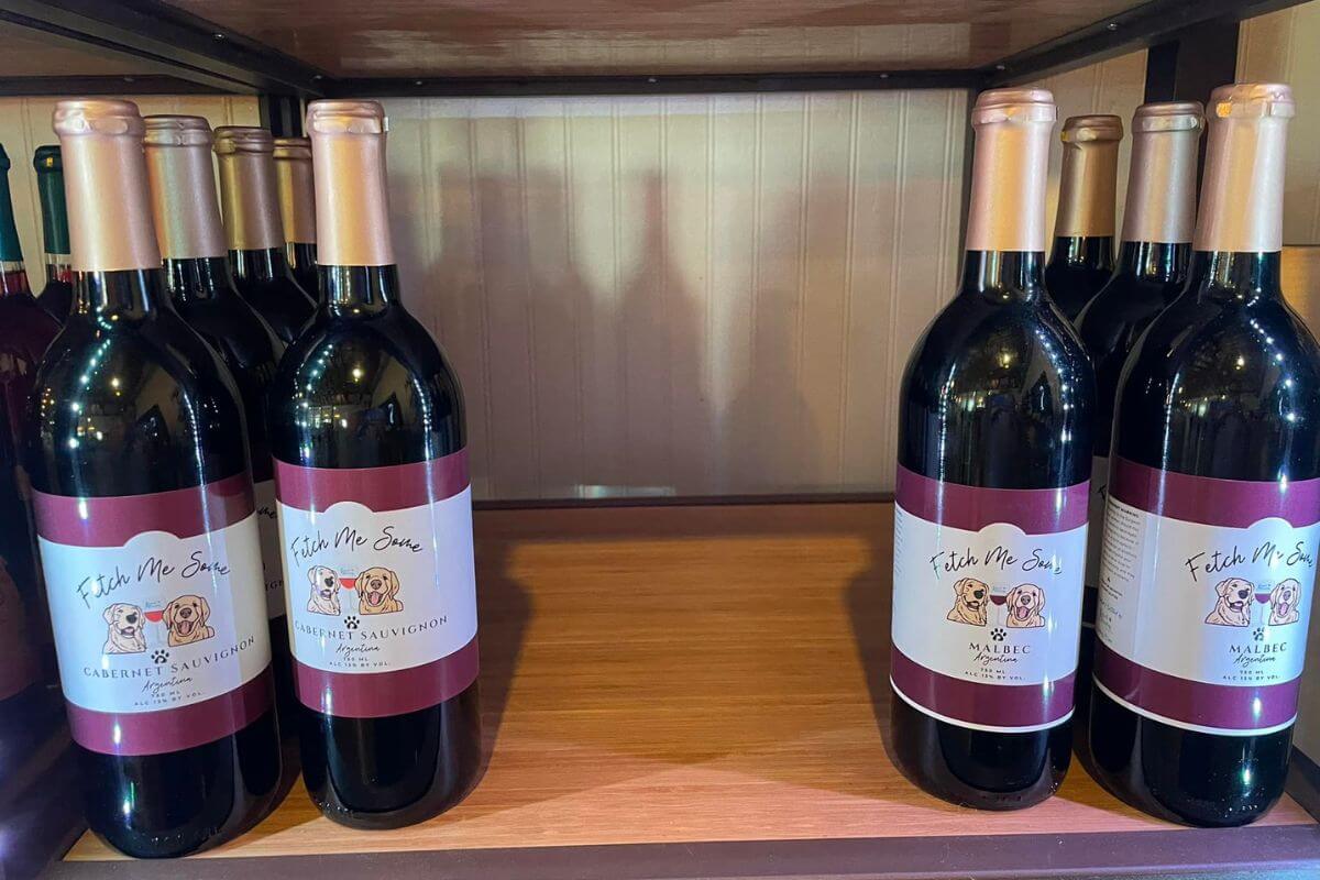 bottles of wine on shelf.