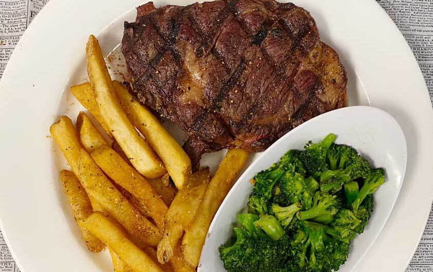 Steak, French Fries, and Broccoli at Historia Pub in Florida 