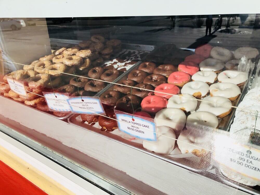 Donuts in a display case. 