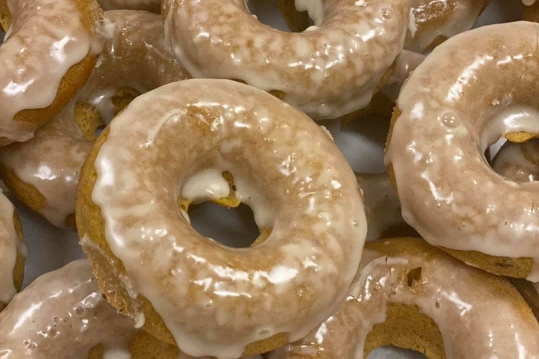 Pumpkin donuts with maple glaze from yum a southern market.
