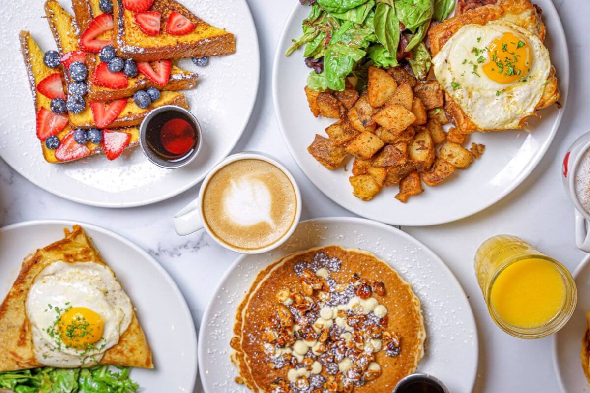 A variety of brunch dishes on plates. 
