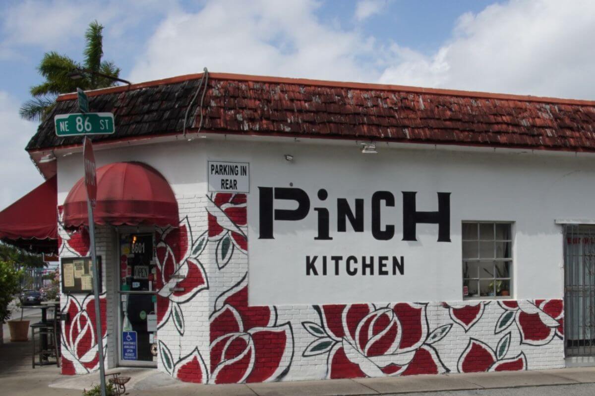 Exterior of a restaurant with the wording Pinch Kitchen on the side. 