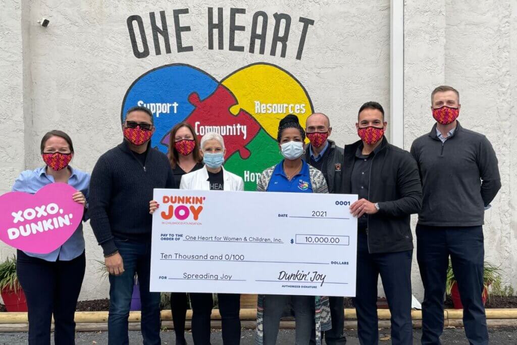 group photo with large check donation