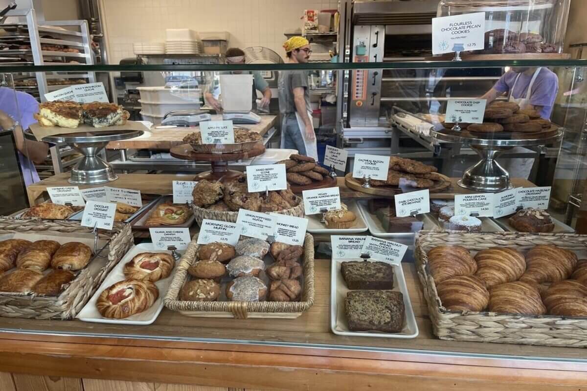 Bakery display filled with a variety of baked goods. 