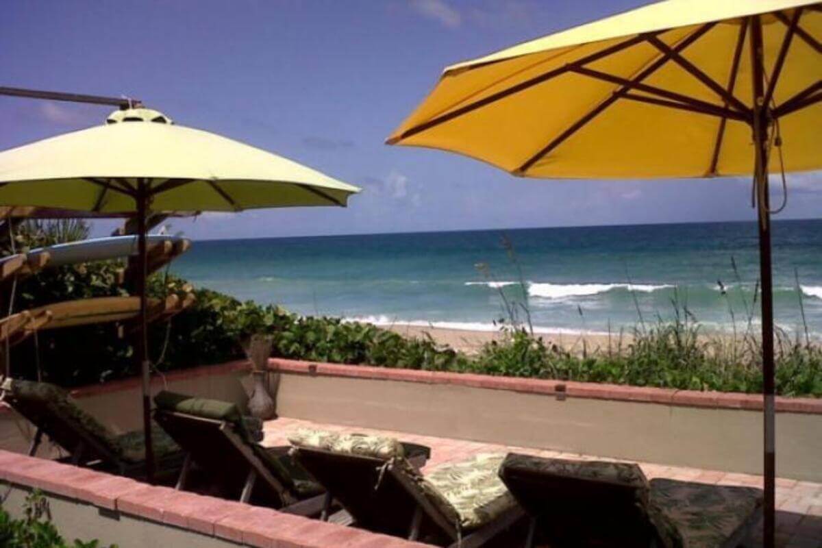 View of the beach from a patio.