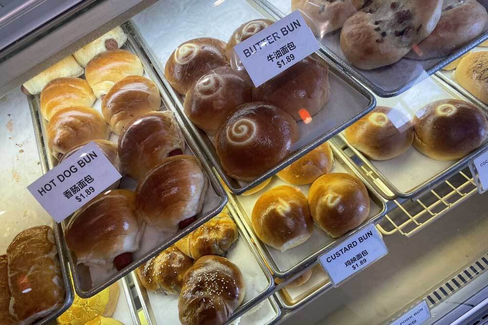 Buns in a bakery case at Fortune Star Oriental Bakery. 