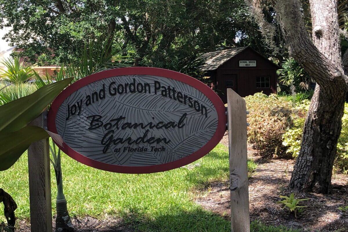 Sign reading Joy and Gordon Patterson Botanical Gardens at Florida Tech. 