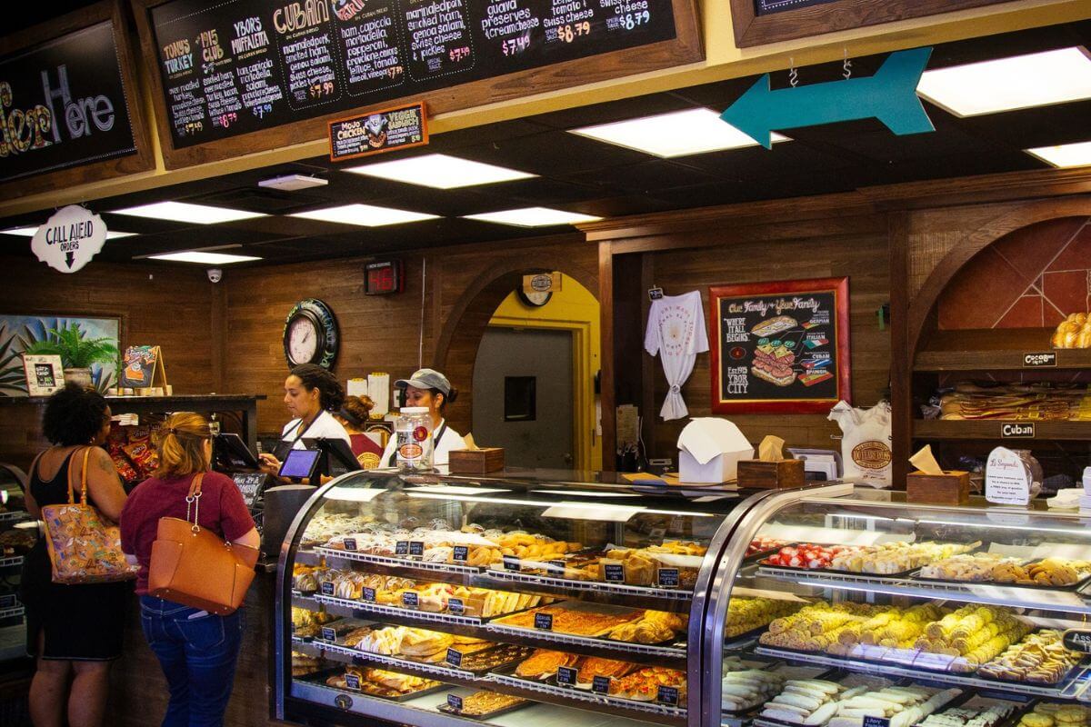 Bakery interior with display case and menu shown. 