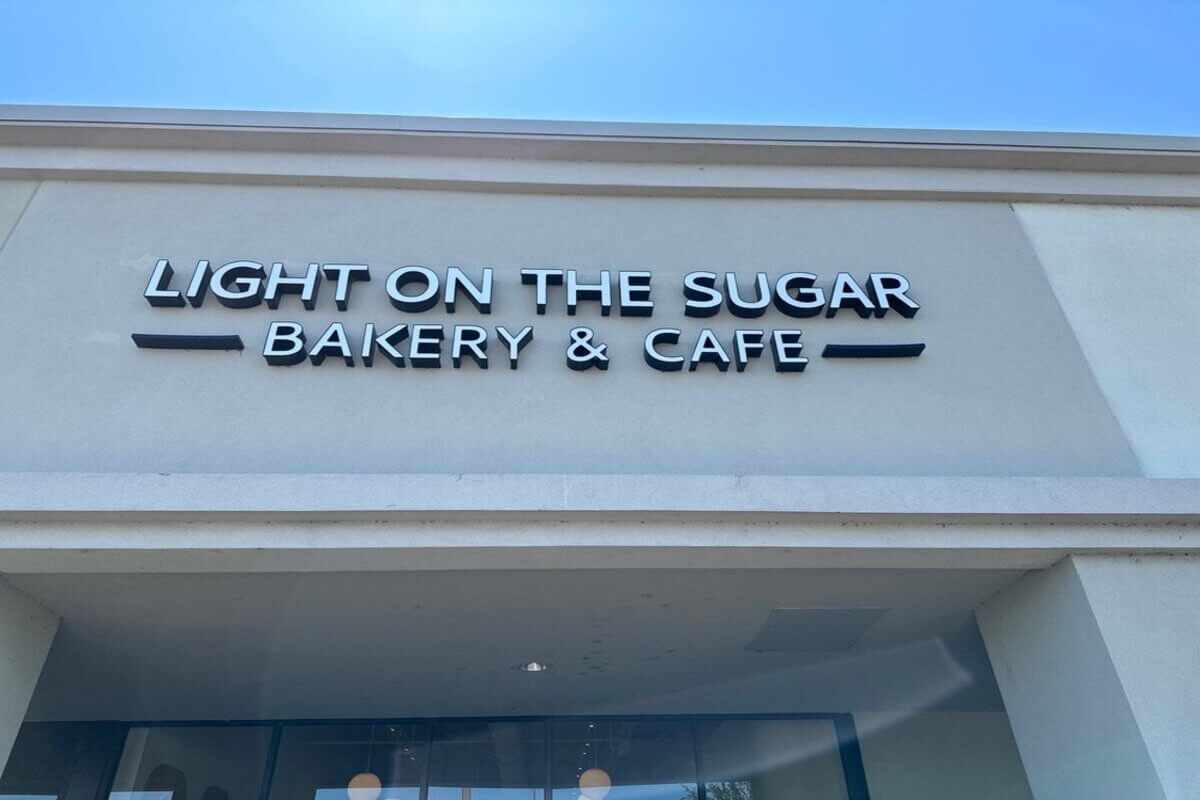Bakery exterior with the wording Light on the Sugar Bakery & Cafe. 