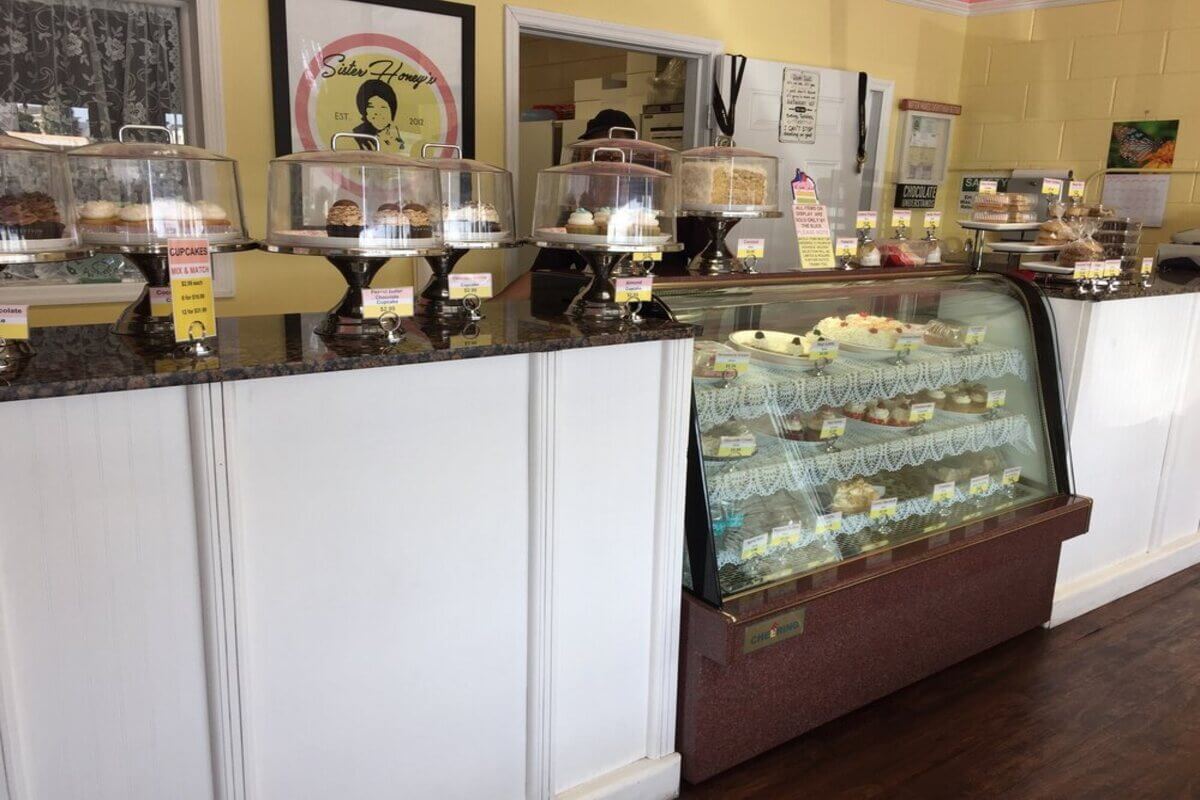 Bakery interior with a variety of cupcakes on display. 