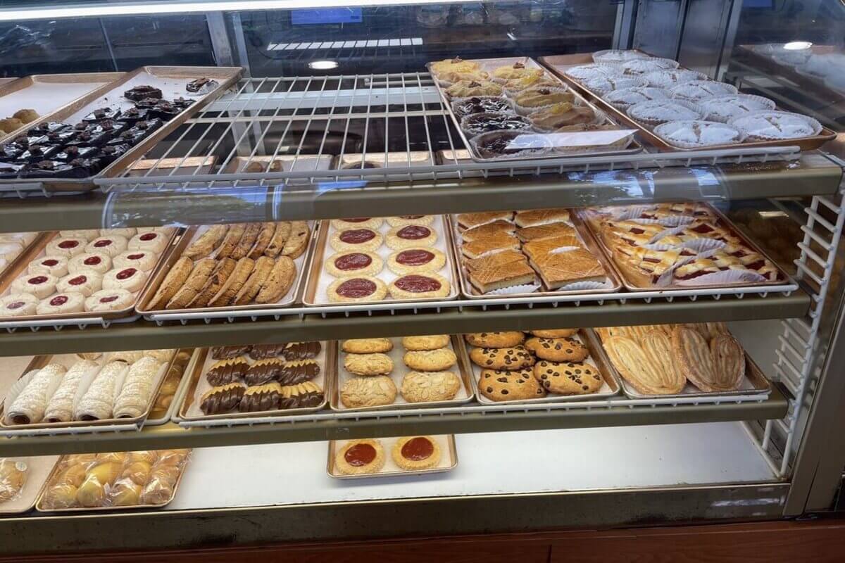 Bakery case with a variety of pastries. 