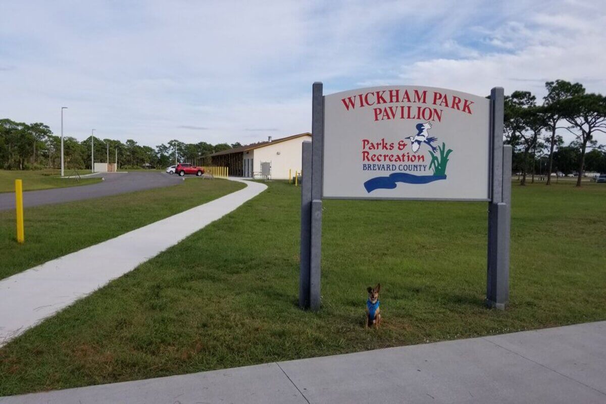 Sign that reads Wickham Park Pavilion Parks & Recreation Brevard County. 
