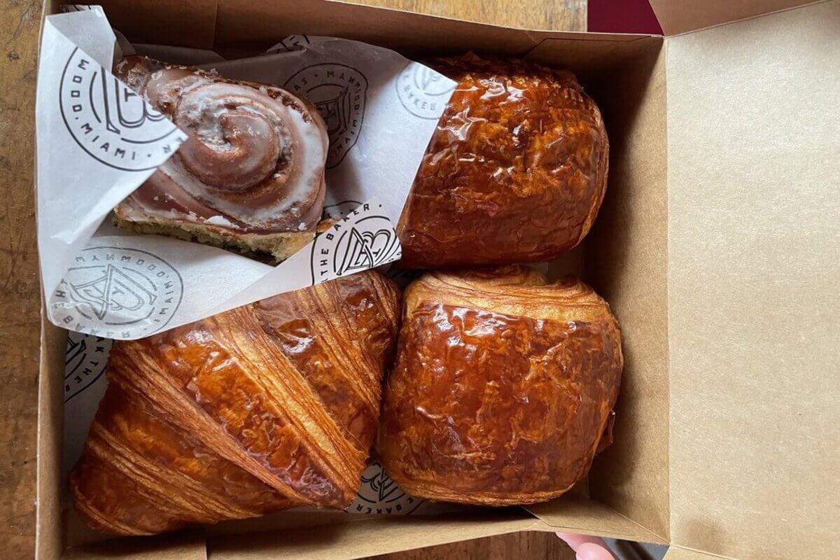Croissants and cinnamon rolls in a box. 