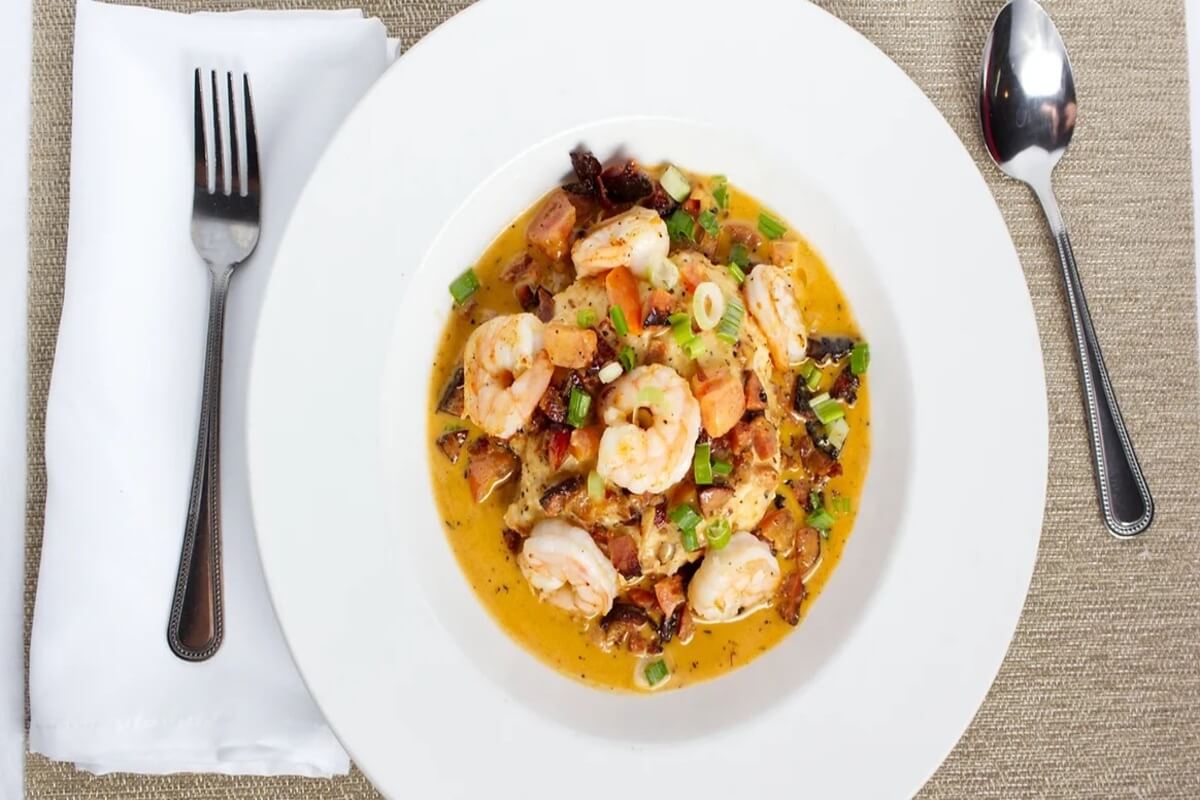 Shrimp dish on a plate on a table. 