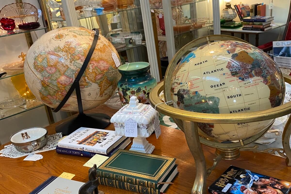 Globes and other items at an antique shop. 