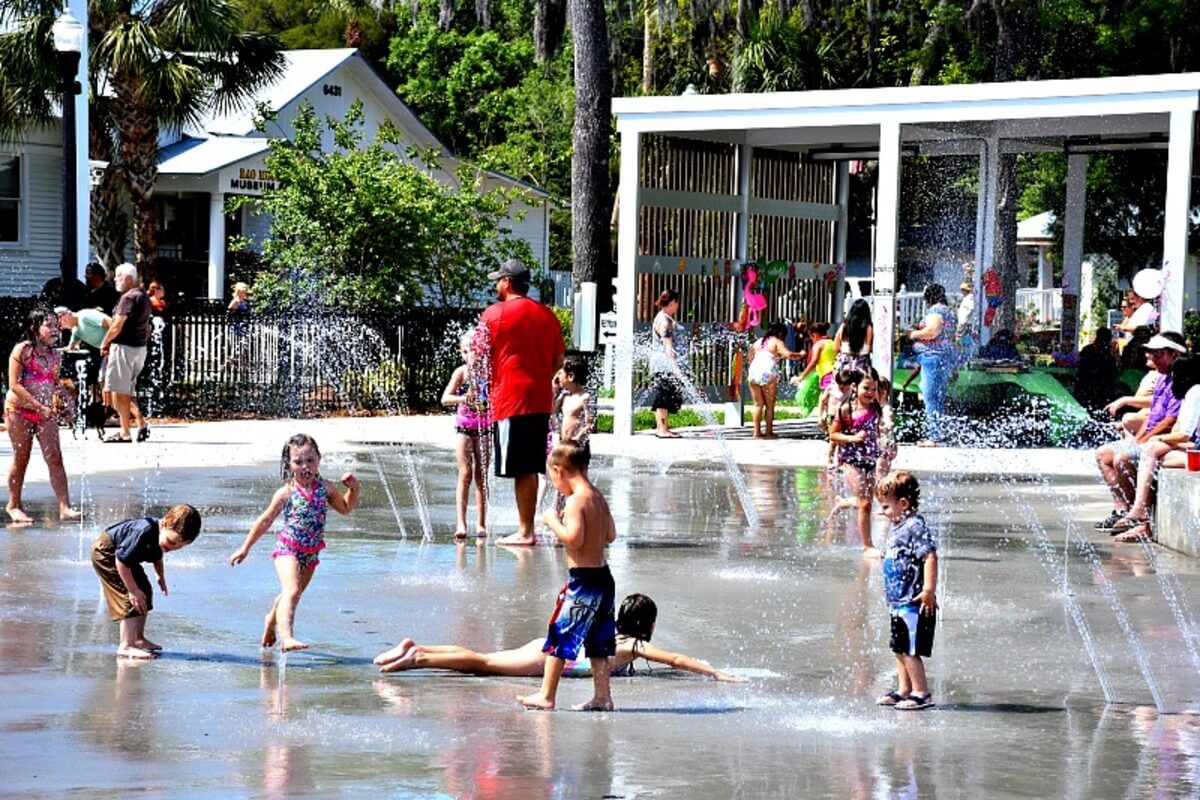 Children playing at a splash pad. 