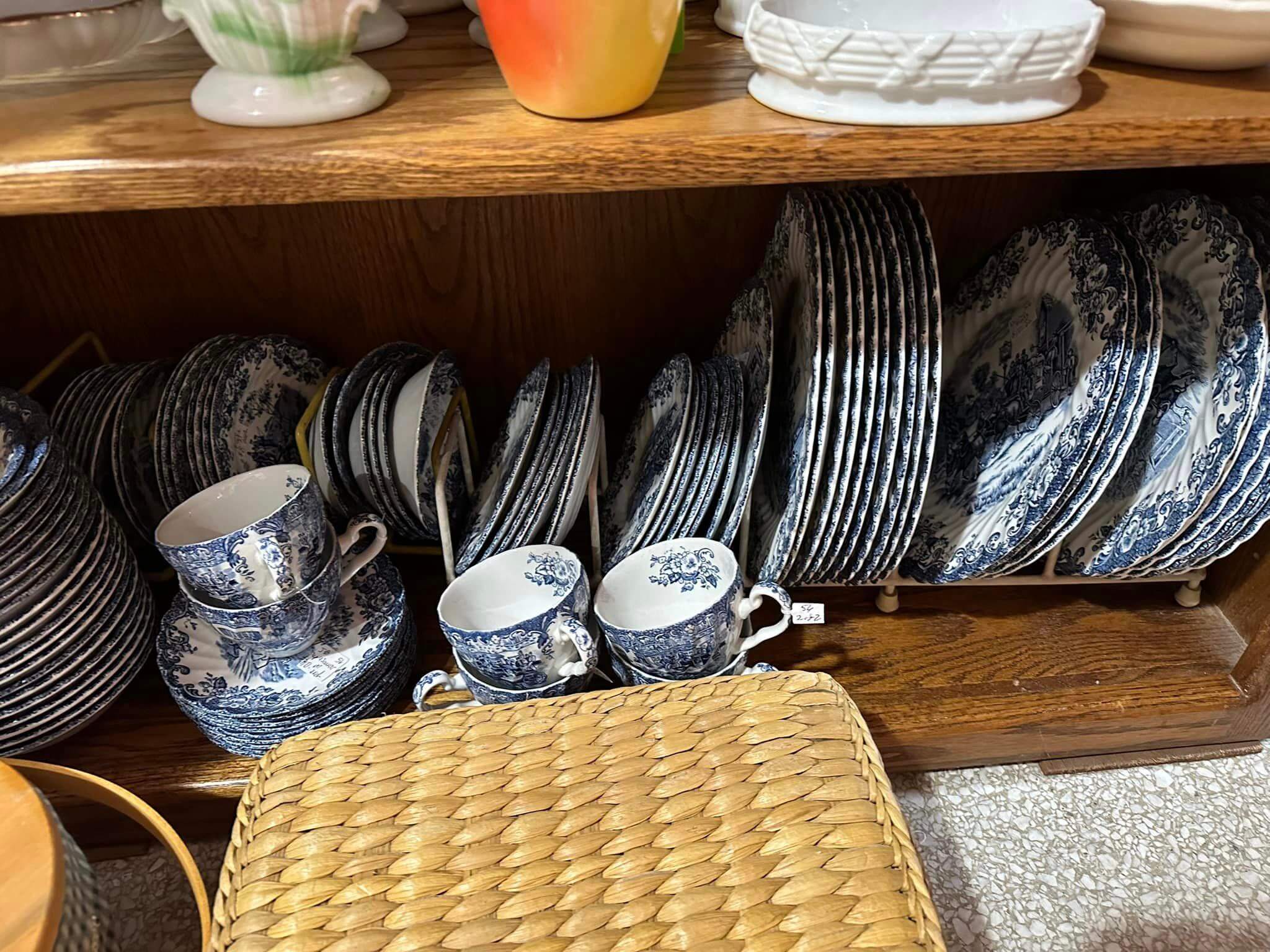 Plates on a shelf. 
