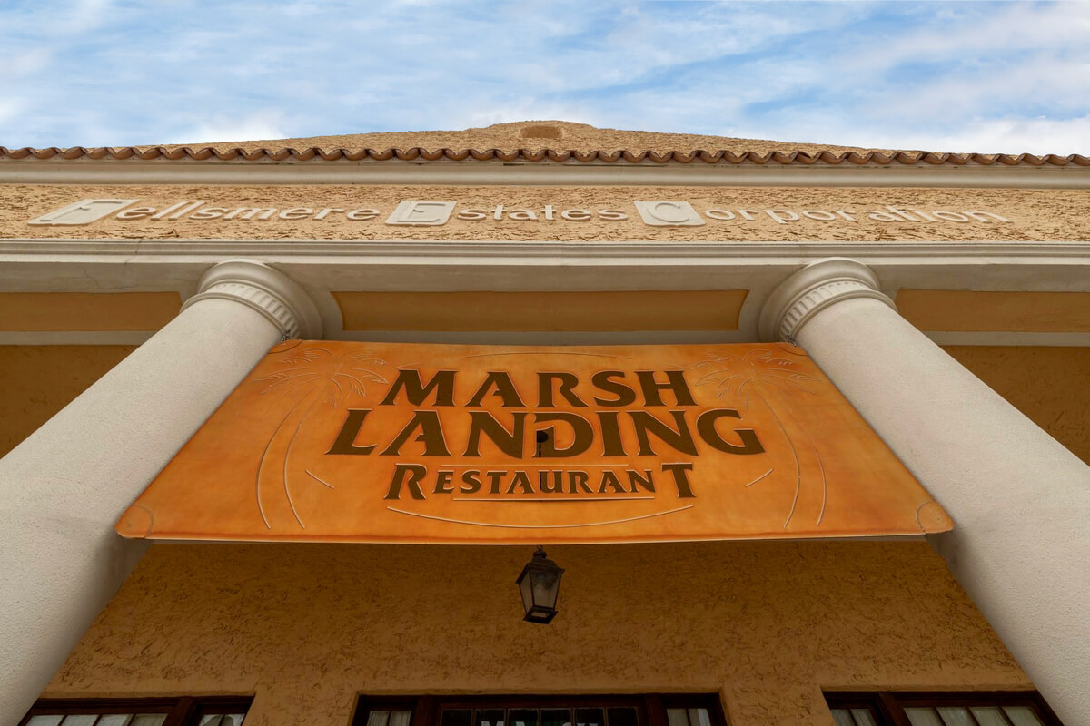 Restaurant sign reading Marsh Landing Restaurant. 