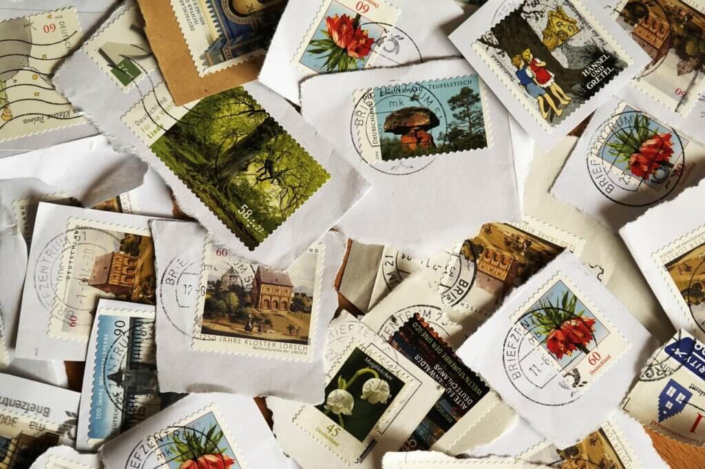 Stamps on display as part of a stamp collection. 