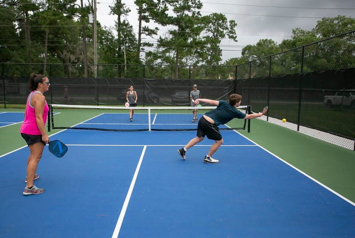 people playing pickleball outside